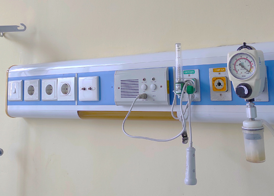 Close up view of an electrical panel inside of a hospital room 