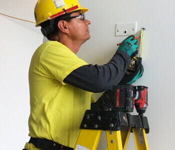 Technician measuring an outlet