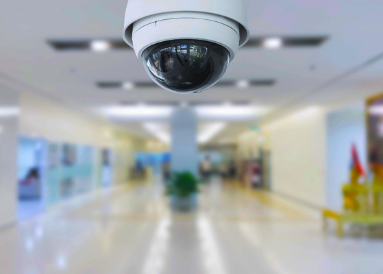 Close up view of a ceiling security camera